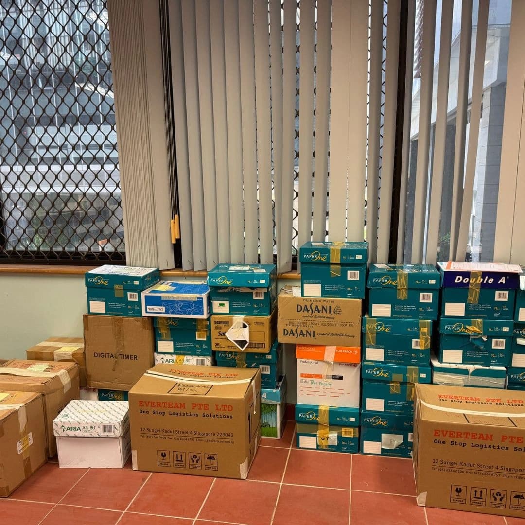 Labelled moving cartons organised for an office relocation